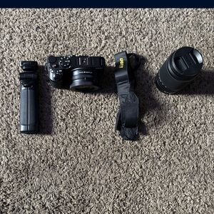 Nikon Z50 Mirrorless Camera with 16-50mm and 50-250mm Lenses with tri pod
